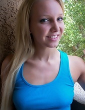 Blonde MILF in blue T-shirt and jean shorts exposes pussy