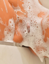 Sexy MILF takes a bath and decides to masturbate pussy with vibrator