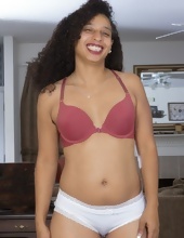 Curly-haired Ebony mom strips naked and shows hairy twat in living room
