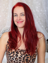 Mature redhead with slim body shows perfectly shaved pussy on camera
