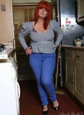 Mature redhead instead of cleaning kitchen wants to show her goodies