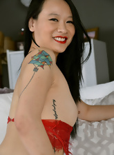 Joyful Asian mom in red lingerie not shy to show assets on the camera