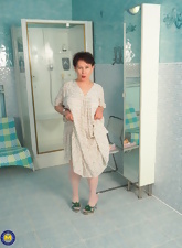 Chubby woman tests stick-on dildo in sexy mature nudes pics