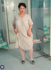 Chubby woman tests stick-on dildo in sexy mature nudes pics