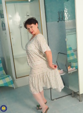Chubby woman tests stick-on dildo in sexy mature nudes pics