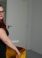 Glasses-wearing BBW chick striking very thoughtful poses