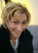 Busty blonde GILF is undressing and showing her wet hole