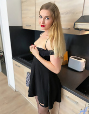 Teaser in the kitchen is going to show her perfect pussy