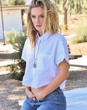 Attractive blonde with small breasts plays with nips