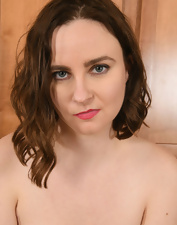 Brunette with short hair teasing in kitchen big time