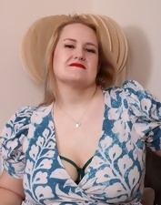 Wearing her green lingerie while seducing the BBW fetishists