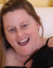 Woman in her cougar age is playing with her thick old body