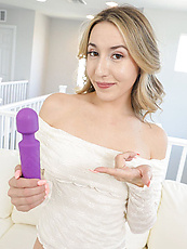 Naked babe solo tease with purple vibrator shows shaved pussy and natural tits