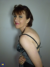 Eccentric mature takes off clothes to show hot body wrapped in lingerie