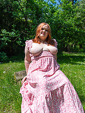 Curvy redhead babe teasing topless in pink floral dress with natural tits and big booty
