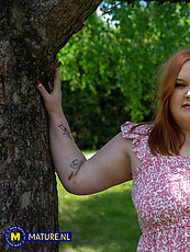 Curvy redhead babe teasing topless in pink floral dress with natural tits and big booty