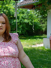 Curvy redhead babe teasing topless in pink floral dress with natural tits and big booty